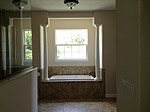 Antigua - masterbath-garden-tub, walk-in shower on left